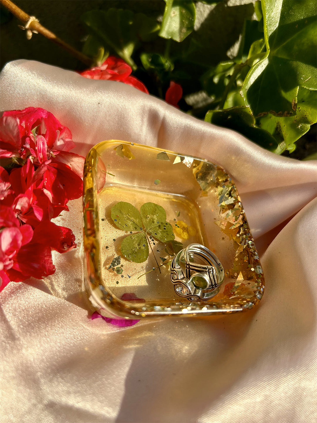 Gold glitter and four leaf clover jewelry tray close up