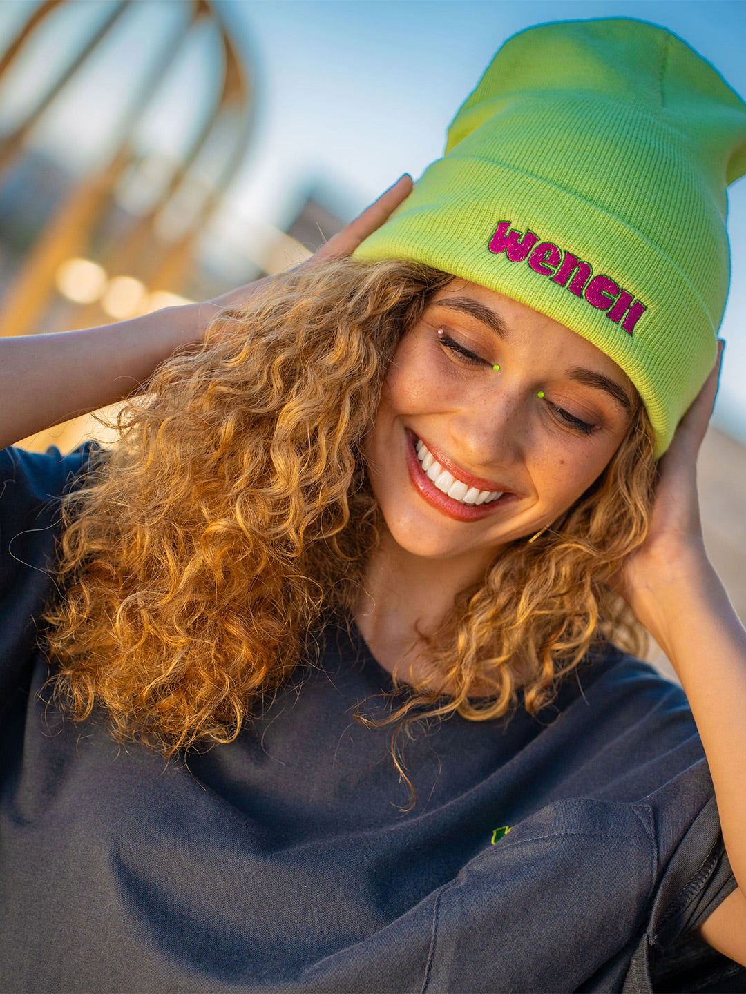 Wenches 2024 Grass is Greener Beanie Pink Green Wench Logo Close Up