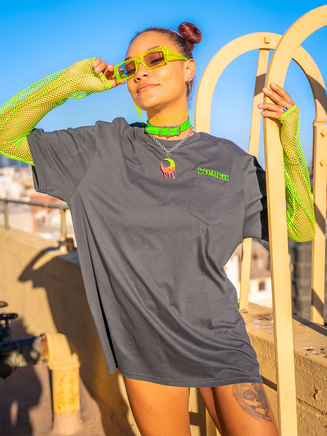 Wenches 2024 Unisex Pocket Tee Green Yellow Logo Front worn as dress